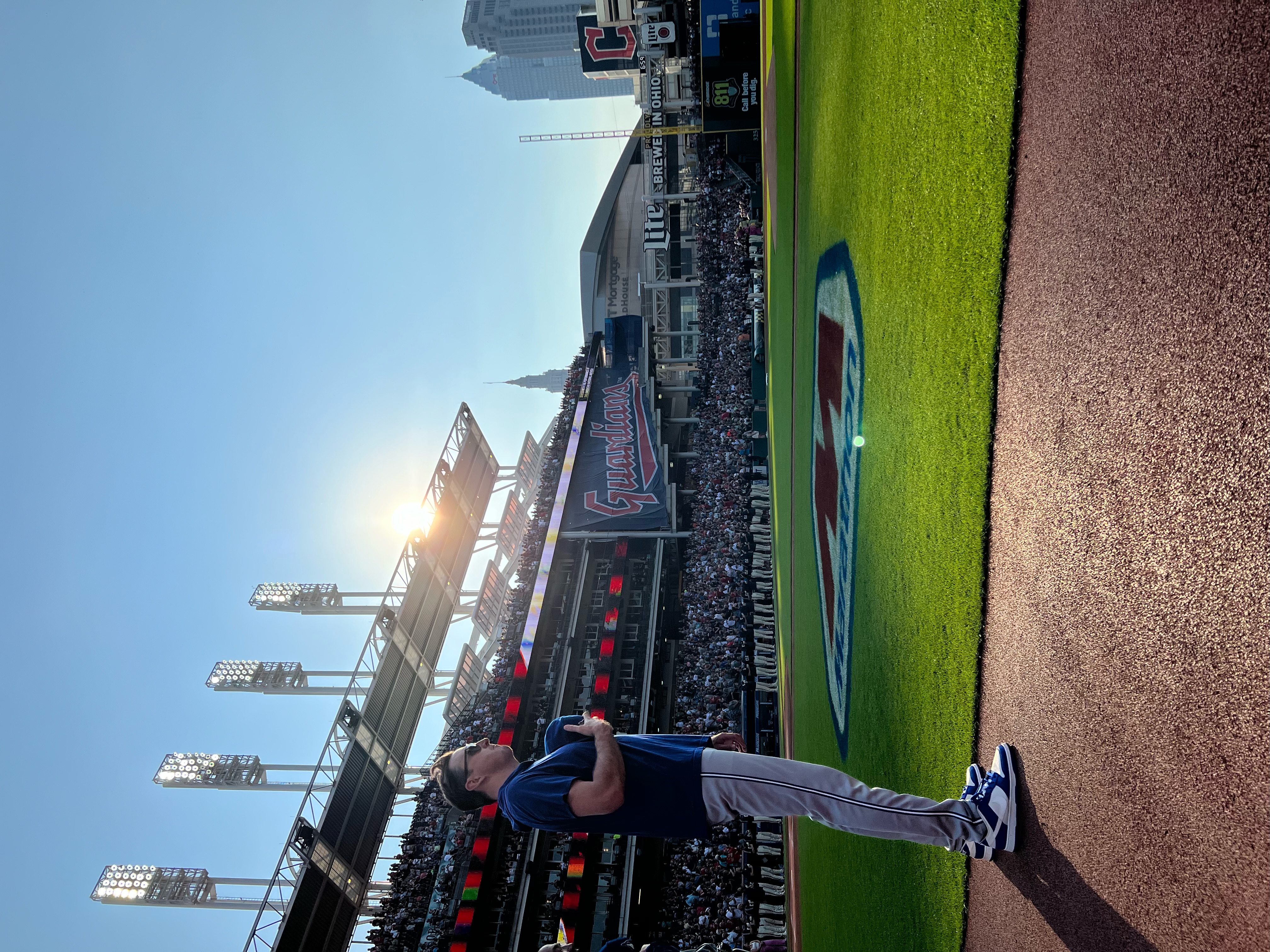 John Lannan standing on the field for the national anthem at a Cleveland Guardians game